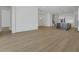 Open floor plan with kitchen featuring stainless steel appliances and hardwood flooring at 15615 Vetta Dr, Montverde, FL 34756