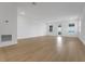 Large living room with wood flooring and a balcony at 15615 Vetta Dr, Montverde, FL 34756
