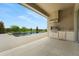 This covered outdoor kitchen with stainless appliances is adjacent to the pool and patio at 15615 Vetta Dr, Montverde, FL 34756