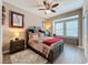 Inviting bedroom with a ceiling fan, window seat, and a fluffy rug at 518 Narrow View Ln, Groveland, FL 34736