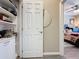 Organized walk-in closet leading to a spacious bedroom with a comfortable bed at 518 Narrow View Ln, Groveland, FL 34736