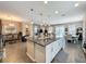 Spacious kitchen island with granite countertop, ample storage, and pendant lighting at 518 Narrow View Ln, Groveland, FL 34736