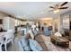 Open-concept living space with a kitchen, dining area, and comfortable living room at 518 Narrow View Ln, Groveland, FL 34736