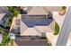 Top-down view of a house showcasing the roofline, backyard, and driveway at 547 Richburg St, The Villages, FL 32162