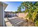 Landscaped backyard oasis with pergola and patio at 547 Richburg St, The Villages, FL 32162