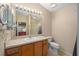 Bathroom with double vanity and a toilet at 547 Richburg St, The Villages, FL 32162