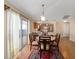 Dining area with a round table and chairs near sliding glass doors at 547 Richburg St, The Villages, FL 32162