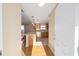 View into kitchen from entryway with hardwood floors at 547 Richburg St, The Villages, FL 32162
