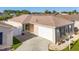 Attractive single-story home with a two-car garage and landscaped yard at 547 Richburg St, The Villages, FL 32162
