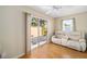 Bright Gathering room with sliding glass doors and comfy seating at 547 Richburg St, The Villages, FL 32162