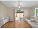Light and bright Gathering room with sliding glass doors leading to the patio at 547 Richburg St, The Villages, FL 32162
