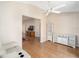 Gathering room with built-in shelving and view into living area at 547 Richburg St, The Villages, FL 32162