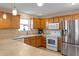 Modern kitchen with stainless steel appliances and a large island at 547 Richburg St, The Villages, FL 32162