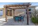 Relaxing patio with pergola and seating area at 547 Richburg St, The Villages, FL 32162