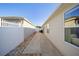 Side yard with walkway and access to backyard at 547 Richburg St, The Villages, FL 32162
