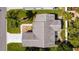 A lovely home sits on a well-maintained lawn with beautiful landscaping and a long driveway at 803 Camino Del Rey Dr, The Villages, FL 32159