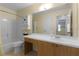 Bathroom featuring a shower-tub combo, toilet, and vanity with mirror at 803 Camino Del Rey Dr, The Villages, FL 32159