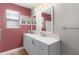 Bathroom showcasing a modern double sink vanity with beautiful stone-look tiling and a shower at 803 Camino Del Rey Dr, The Villages, FL 32159