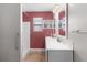 Bathroom showcasing a modern double sink vanity with beautiful stone-look tiling and a shower with grab bars at 803 Camino Del Rey Dr, The Villages, FL 32159