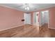 Spacious bedroom with hardwood floors, a ceiling fan, and access to the bathroom and walk-in closet at 803 Camino Del Rey Dr, The Villages, FL 32159