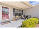 Cozy front porch featuring outdoor seating and a decorative front door, great curb appeal at 803 Camino Del Rey Dr, The Villages, FL 32159