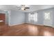 Inviting living room boasts gleaming hardwood floors, neutral walls, and a welcoming atmosphere at 803 Camino Del Rey Dr, The Villages, FL 32159