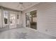 Enclosed patio with lots of natural light and access to both the house and backyard at 803 Camino Del Rey Dr, The Villages, FL 32159