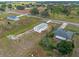 Aerial view showing a manufactured home and additional lot at 25013 Van Buren St, Astatula, FL 34705