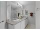 Bathroom with double sinks, updated fixtures, and a walk-in shower at 8194 Se 177Th Winterthur Loop, The Villages, FL 32162
