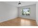 Bright bedroom featuring natural light, hardwood floors, and ceiling fan at 8194 Se 177Th Winterthur Loop, The Villages, FL 32162