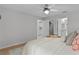 Bright bedroom featuring natural light, hardwood floors, and easy access to other rooms at 8194 Se 177Th Winterthur Loop, The Villages, FL 32162