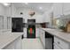 Kitchen with black appliances and tile backsplash at 8194 Se 177Th Winterthur Loop, The Villages, FL 32162