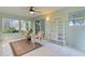 Bright sunroom with tiled floors, and ceiling fan at 8194 Se 177Th Winterthur Loop, The Villages, FL 32162