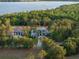 Gorgeous lakefront home surrounded by lush greenery and serene water views for a peaceful, nature-filled setting at 16909 Crete Way, Bella Collina, FL 34756