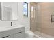 Modern bathroom with glass shower, tiled walls, floating vanity, and black hardware at 16909 Crete Way, Bella Collina, FL 34756