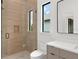 Beautiful bathroom features frameless glass shower and sleek vanity at 16909 Crete Way, Bella Collina, FL 34756