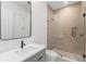 Contemporary bathroom featuring light fixtures, vanity with modern hardware, and glass enclosed shower at 16909 Crete Way, Bella Collina, FL 34756