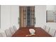 Dining room featuring a custom wine display and a stylish dining table at 16909 Crete Way, Bella Collina, FL 34756
