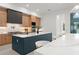 Bright kitchen features a large island with seating, modern appliances, and stylish cabinetry at 16909 Crete Way, Bella Collina, FL 34756