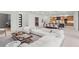Open-concept living area with a modern kitchen, dining space, and comfortable lounge at 16909 Crete Way, Bella Collina, FL 34756