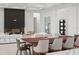 Open floor plan showcasing living area with fireplace and dining space at 16909 Crete Way, Bella Collina, FL 34756