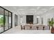 A view of the open-concept living space, highlighting the fireplace and dining area at 16909 Crete Way, Bella Collina, FL 34756