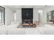 Bright living room featuring a modern fireplace and luxurious white sofa set at 16909 Crete Way, Bella Collina, FL 34756