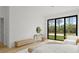 Bright main bedroom with a large sliding glass door, contemporary decor, and outdoor views at 16909 Crete Way, Bella Collina, FL 34756