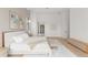 Spacious main bedroom with light wood floors and contemporary decor at 16909 Crete Way, Bella Collina, FL 34756