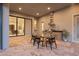 Beautiful outdoor kitchen and dining area perfect for entertaining with easy access to indoor spaces at 16909 Crete Way, Bella Collina, FL 34756