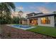 Beautiful backyard featuring a pool with integrated spa and manicured landscaping at 16909 Crete Way, Bella Collina, FL 34756