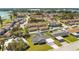 Aerial view of a neighborhood featuring single-Gathering homes with mature trees and community amenities nearby at 2030 Leisure Dr, Winter Haven, FL 33881