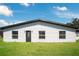Ranch-style home featuring a traditional front door, vinyl siding, and double-hung windows at 2030 Leisure Dr, Winter Haven, FL 33881
