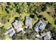 Aerial view of property featuring a private pool, surrounded by lush greenery and neighboring homes at 210 Westcott Ct, Deland, FL 32724